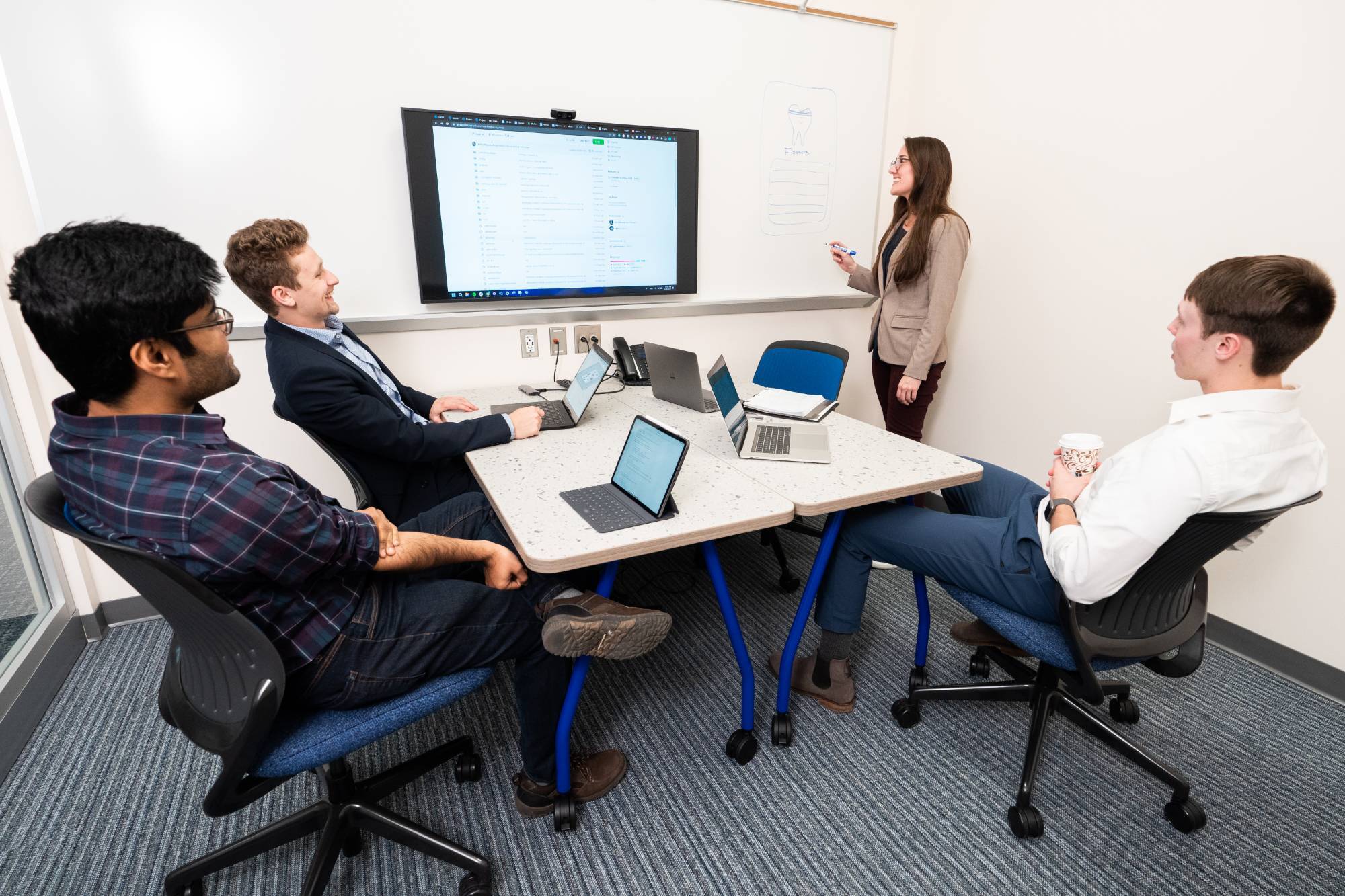 ACI Students around a table smiling